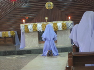 One nun praying